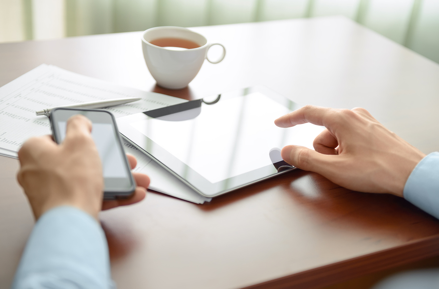 Businessman working at his workplace and using new technologies for success workflow.